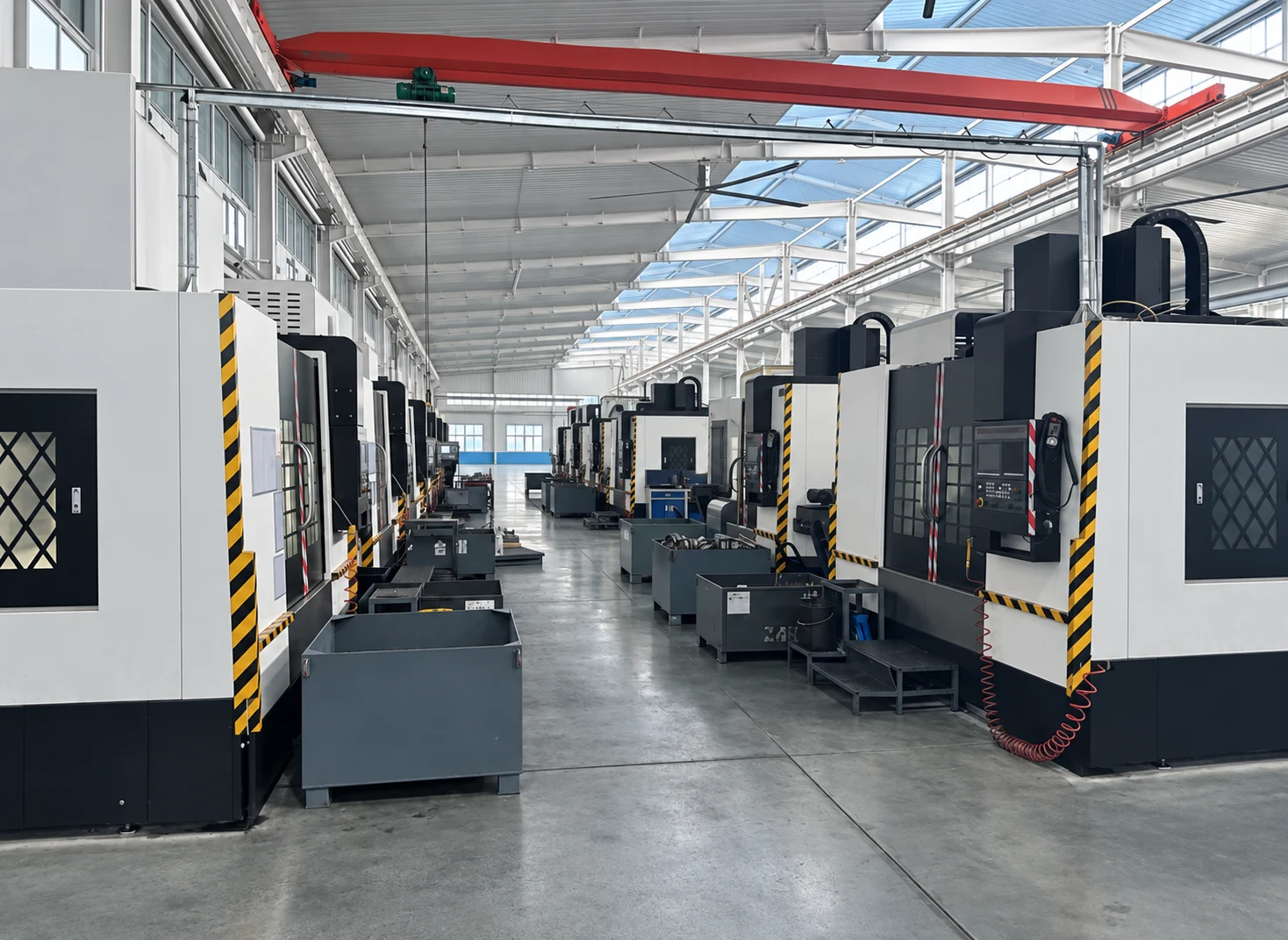 Machining centers along a workshop aisle.